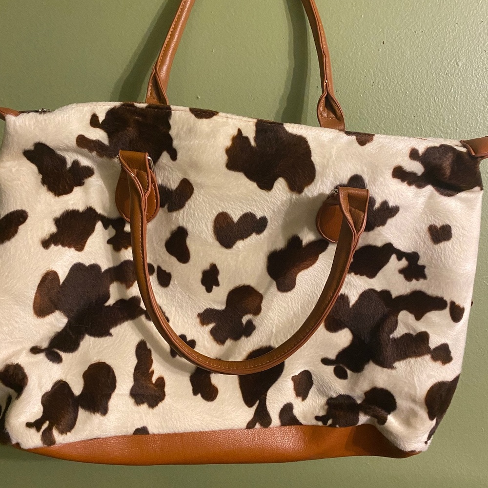 Cow hide bag. Good to use for overnight stay.